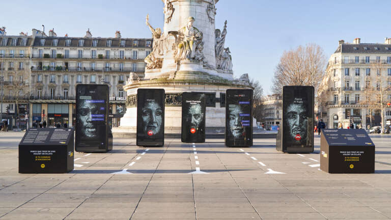 Wide shot of the “Vies Brisées” exhibition set up at Place de la République.