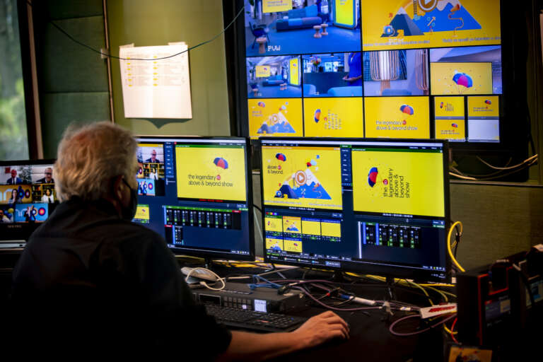 Director operating the "Above & Beyond" show live broadcast from the control room.