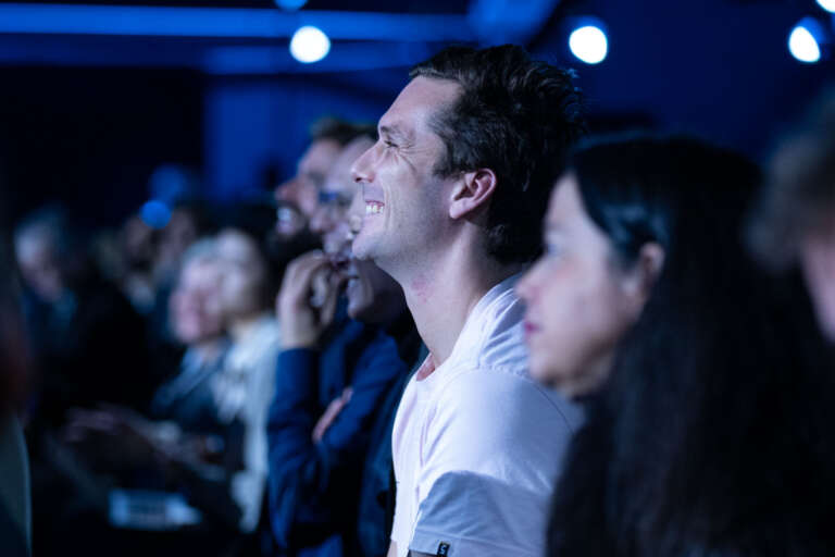 Engaged audience during a conference, showcasing the impact of well-crafted B2B content