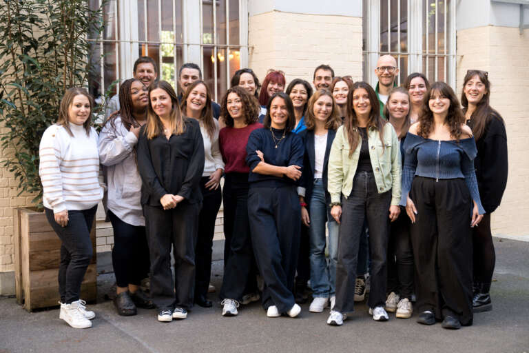 OVAL team photo in front of the office, embodying accessibility and collective strength