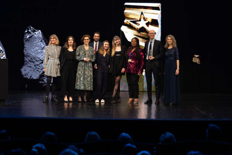 The project team on stage after receiving an award for the Paris Aéroport campaign.