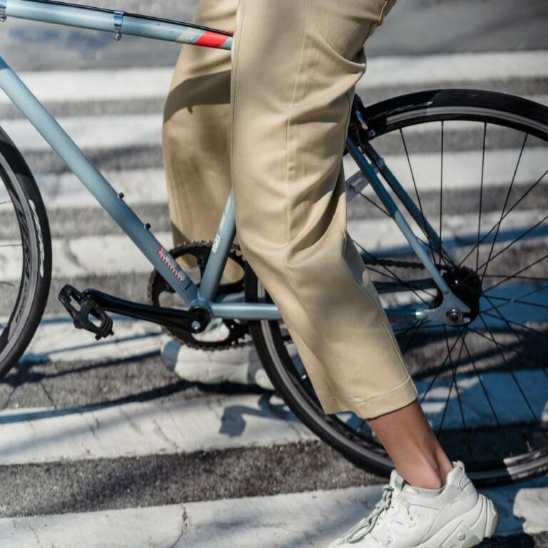OVAL employee commuting by bike, reflecting a commitment to sustainable mobility